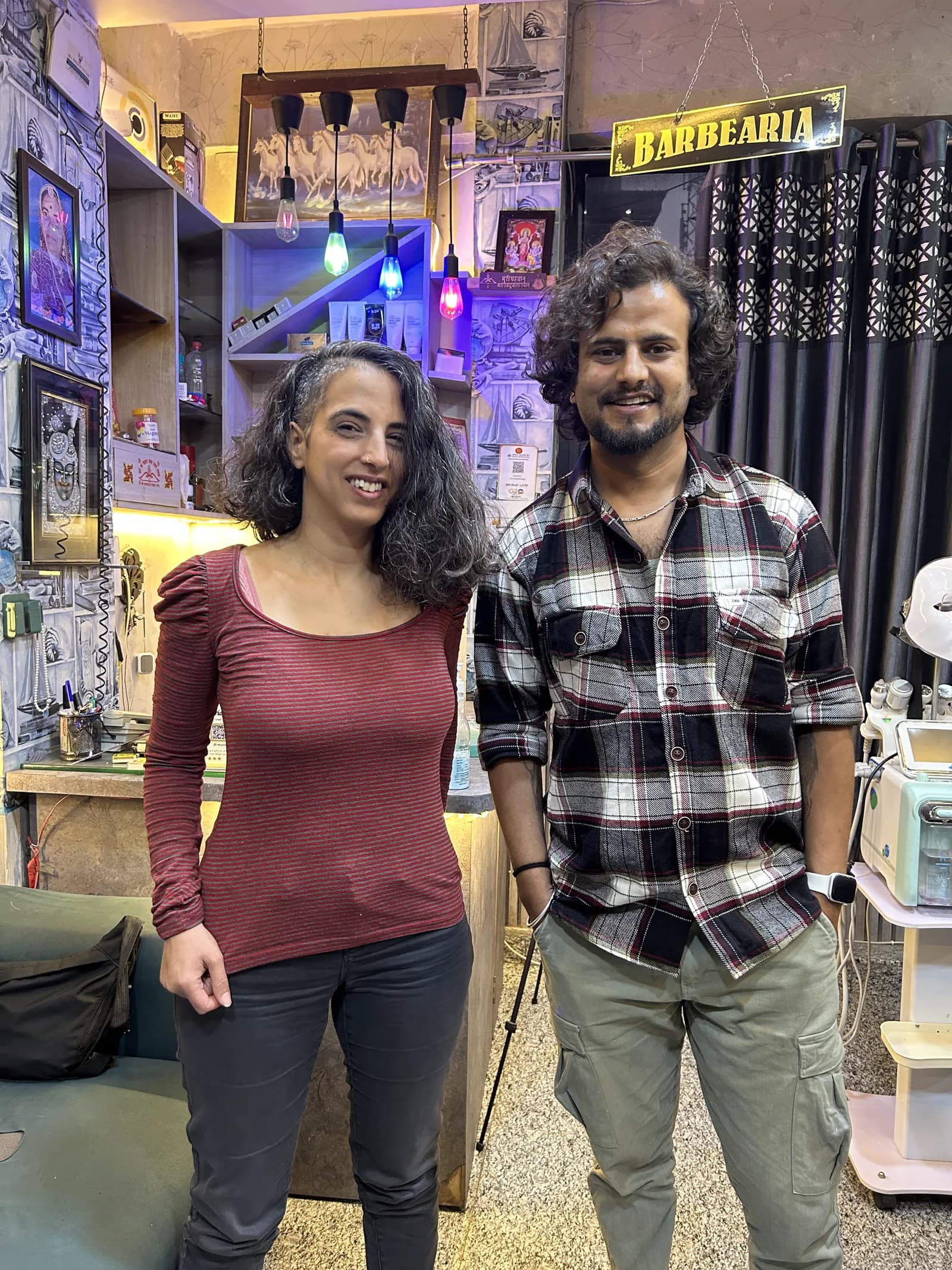 A client and stylist at SN Barbearia in Pushkar