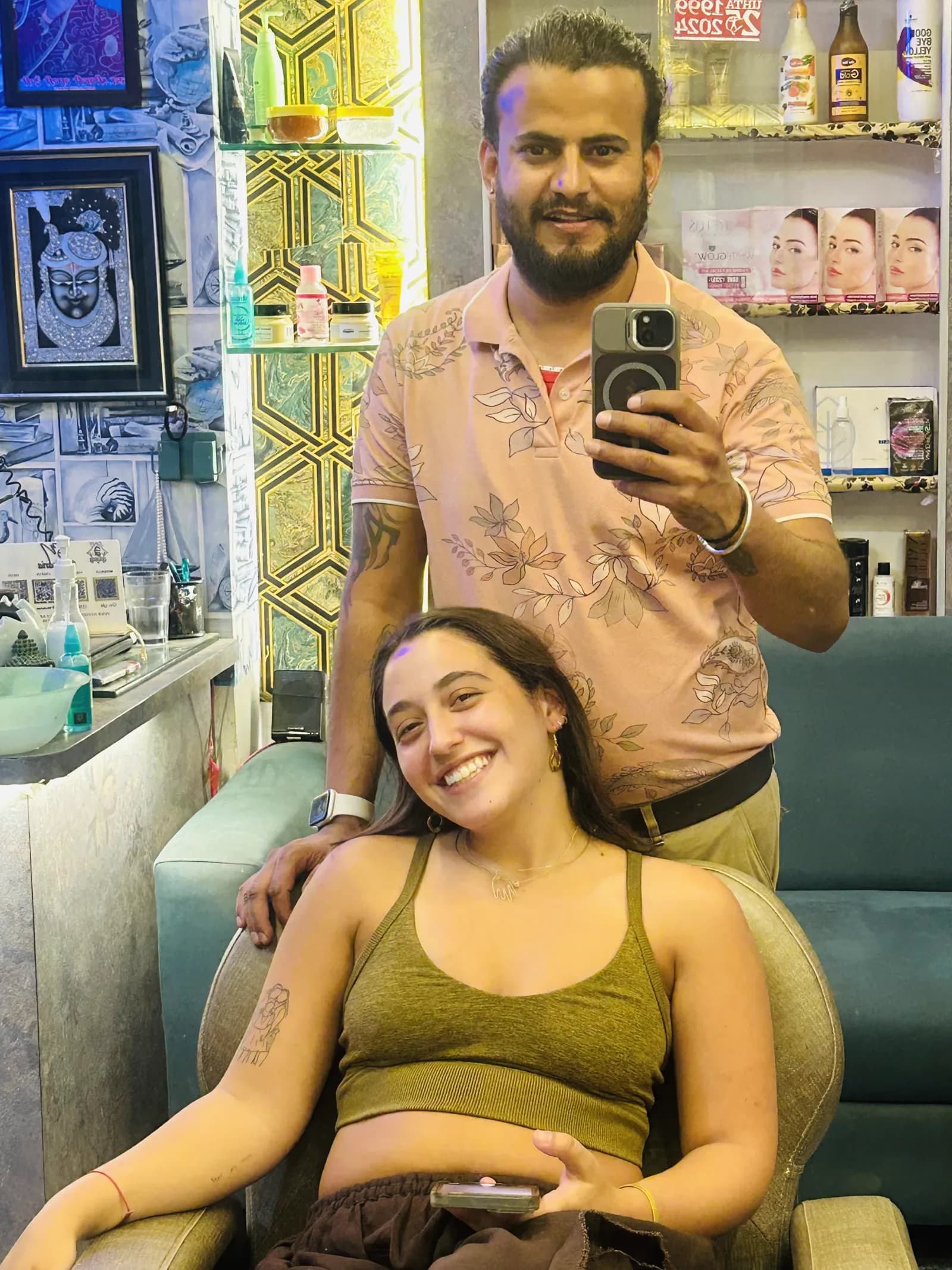 A happy guest with her stylist at the Pushkar salon